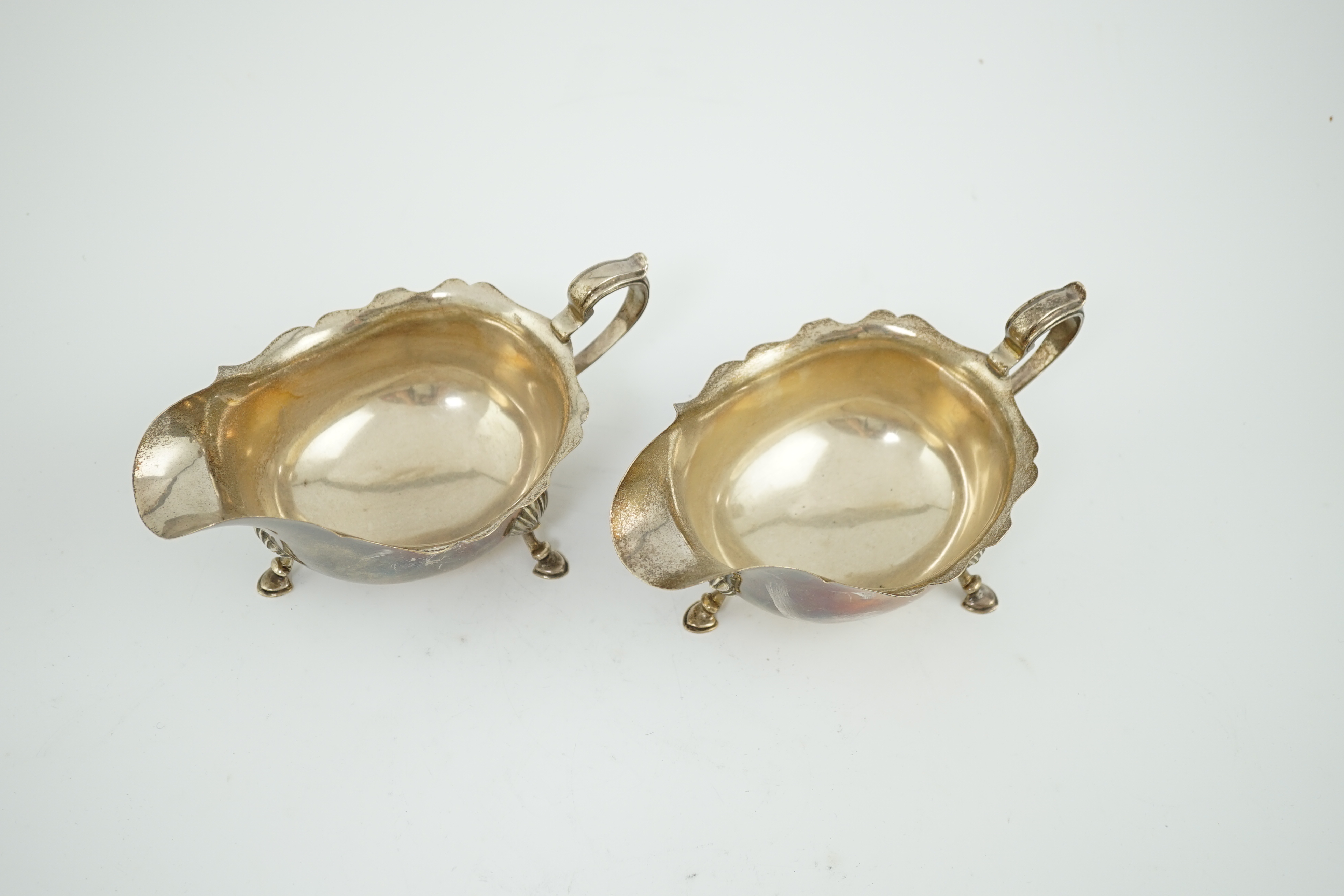 A pair of Elizabeth II silver sauce boats, maker A over HA